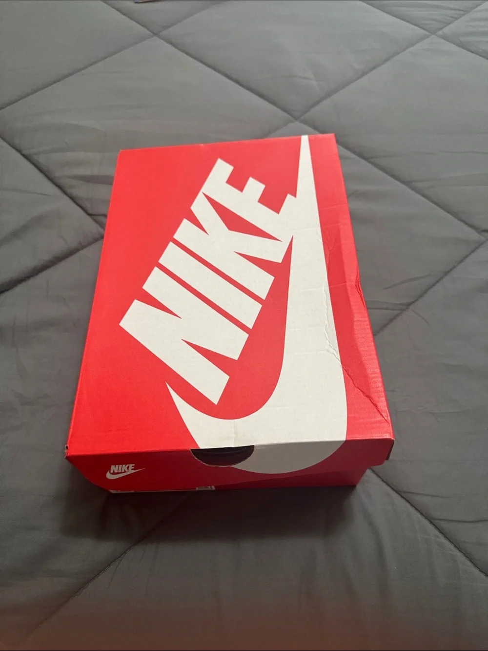 Nike Kids White Sneakers with Orange Swoosh Accent